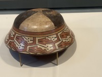 Bowl with interlocking fish and snakes